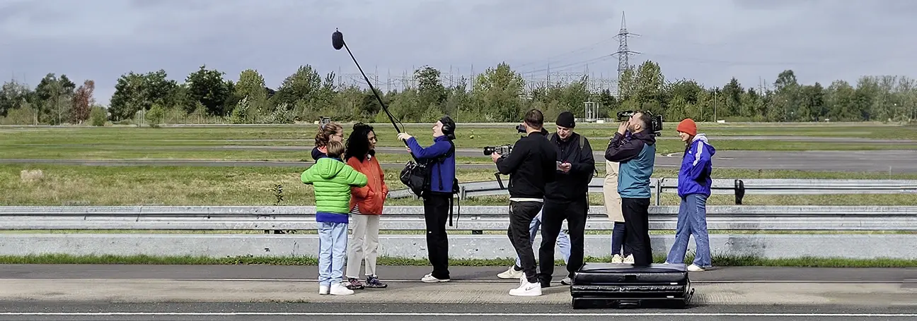 [Photo: Film team from 