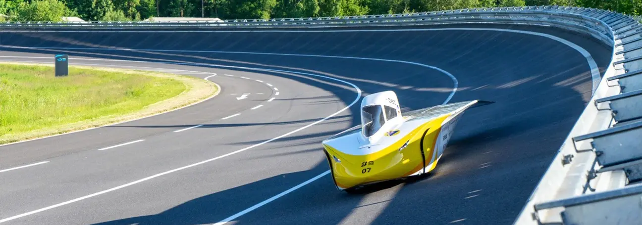 [Sun car “Aethon” on a banked curve]