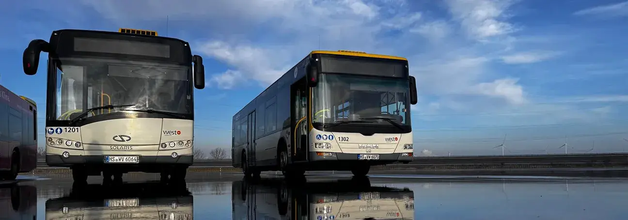 [Photo: Buses on the watered vehicle dynamics area]